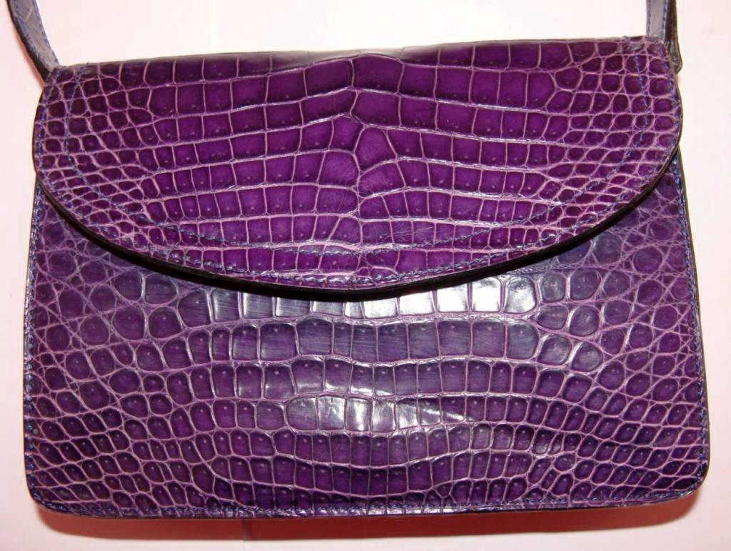 Custom crocodile bag made for Jane Engelhard (1917-2004), well known philanthropist and socialite.

The shoulder strap is detachable so the bag can be used as a clutch.

There is nothing more to say--Asprey says it all.
