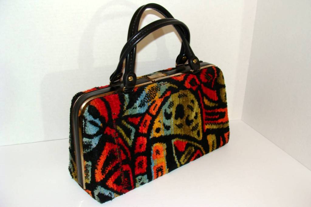 This colorful, yet practical bag takes a monochromatic ensemble from safe to smashing.  <br />
<br />
We sold this bag about 10 years ago and it is back for us to find a new owner.  <br />
<br />
It has a spacious interior and can hold
