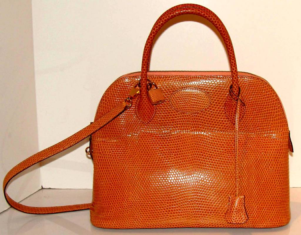 Fabulous and rare lizard Bolide from Hermes.  

Perfect bag for everyday--classically elegant and a workhorse.  The lizard is more durable than most other materials and should last a lifetime.  

The color is neutral and coordinates with