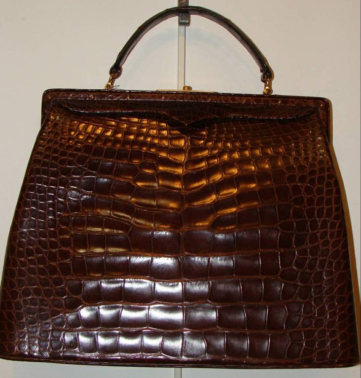 Rich chocolate brown kelly bag with perfect proportions.

This bag is a consignment from a long-time customer who held the top post at a Fortune 500 company. She has retired and has more bags than she can use and has asked us to help her