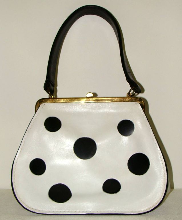 We are offering a rare black and white leather purse.  We have collected since the 1970s and have seen this bag only this example. <br />
<br />
We know that dots are 