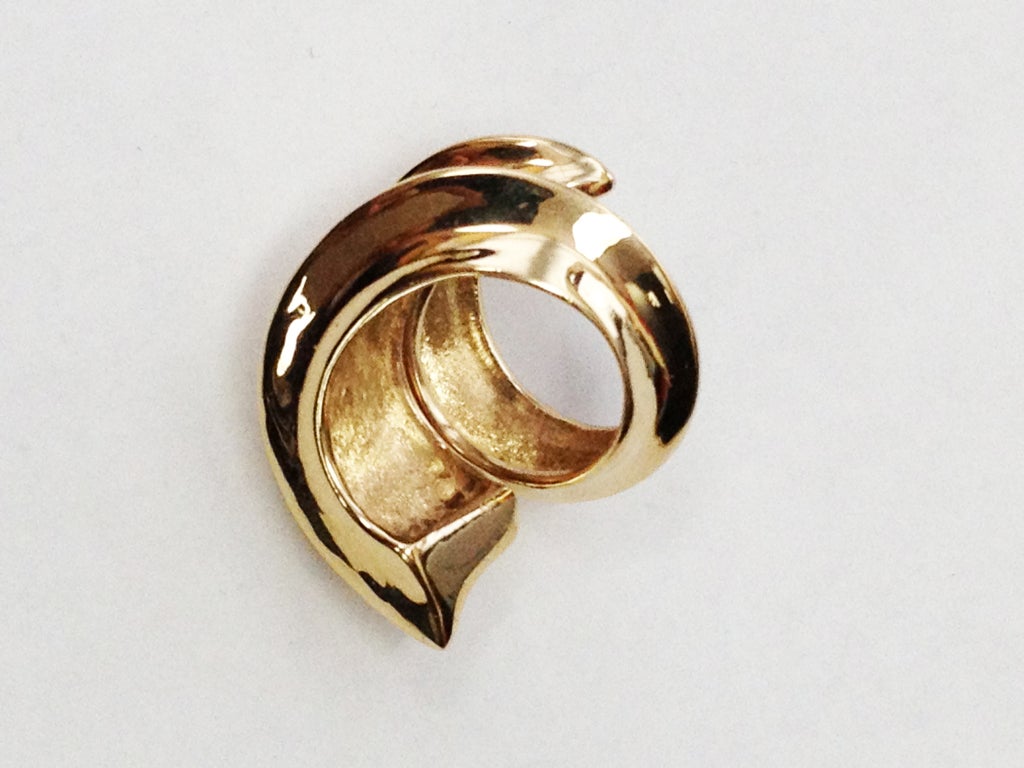 Beautiful 14k yellow Gold Swirl Runway Ring. Top measures approx. 21.5mm. Approx. weight: 21.2 gm. *Also available in pink gold. **Please email us your ring size and we will do the re-sizing for you. This avant-garde ring is simple and so