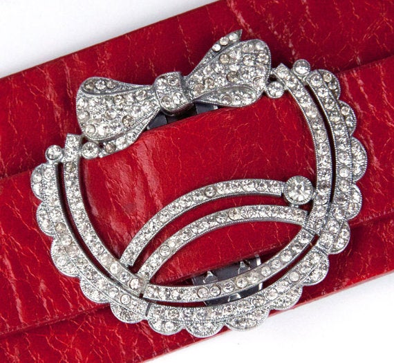 A unique Art Deco Sparkling encrusted CZ (cubic zirconium) Art Deco Bow Clip on a Leather Cuff...Wow! Featured here on a scarlet red leather cuff. Adjustable, fits almost all wrists, comfortably. Easily worn from day to night, you are guaranteed to