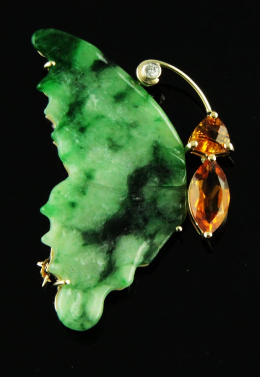 Brilliant pair of Tropical Green Jade, Citrine and Diamond Flying Butterfly Brooches hand crafted in 14k yellow gold, featuring fabulous hand carved Jade Wings. Each pin measure approx. 1.75" by 1" 
Approx Citrine sizes: 2 at 6x6 mm  