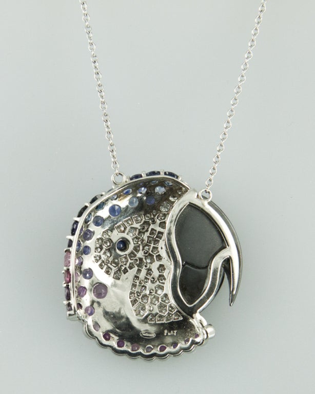 Signed Salavetti Platinum Pendant Necklace; Hand made Parrot Head, Hand set with Diamonds Sapphires and Hematite. The unique combination of Diamonds, Pink and Blue Sapphires and Hematite makes it truly Beautiful and Avant-garde. Marked: Salavetti