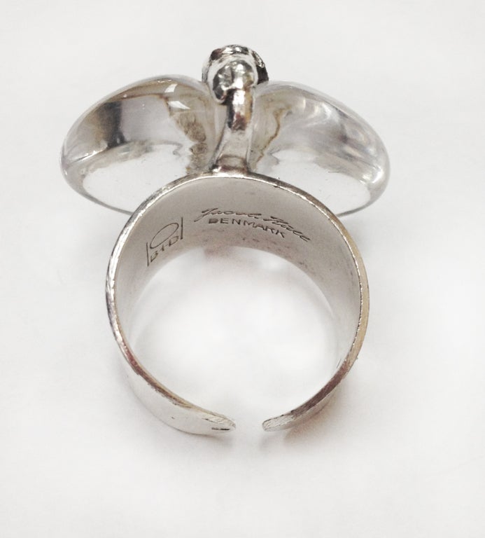 Dynamic Rare Jacob Hull Abstract handmade design Ring set with a white crystal, measuring approx. 28.5mm x 27mm; overlapped by a stylized textured band. Interior of split shank signed:  