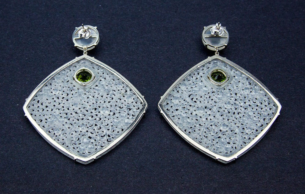 Exquisite pair of large drop earrings hand crafted with excellent craftsmanship utilizing fine precious stones and metal; the jades' color is exceptional, very translucent; featuring beautifully hand carved Diamond-shaped Icy Jade discs, each