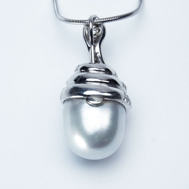 Beautiful Large South Sea Pearl Pendant coiled by a Diamond Snake…all hand crafted in 14 Karat white gold, set with brilliant-cut diamonds, weighing approx. 0.57ct., suspended from a 14k white gold, snake-style chain, measuring approx. 18 inches