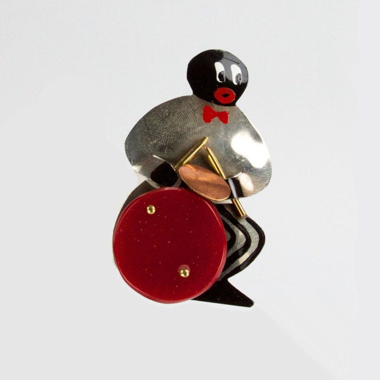 Josephine Baker's members of her Swinging Jazz Band Scatter Pins, complete Combo of eight musicians comprising: Banjo, Saxophone, Accordion, Keyboard, Bass, Trumpet, Clarinet Players and a Drummer. Hand wrought and hammered chrome, red