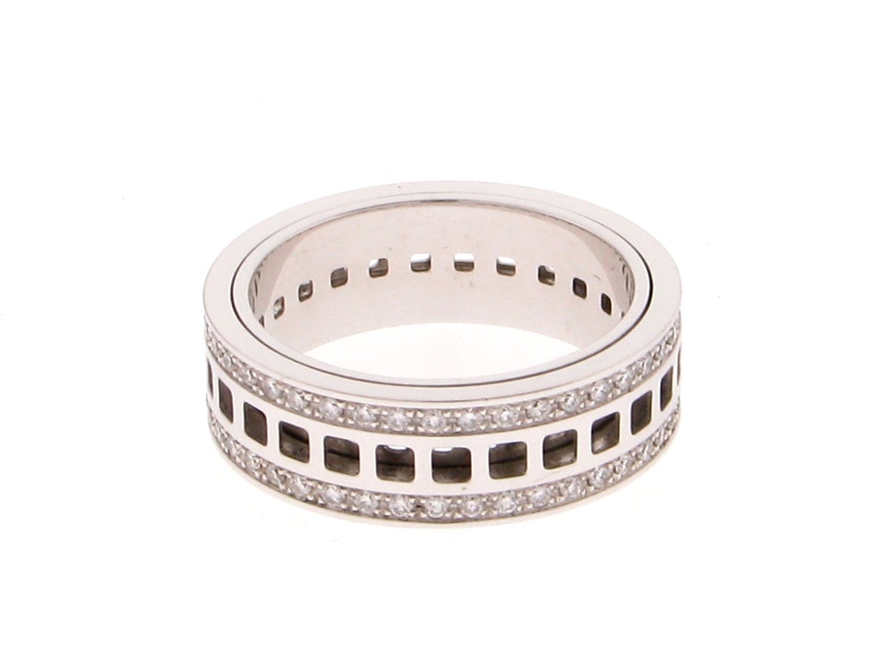 Traditional and Elegant signed Gucci Unisex 18K white gold Diamond Spinning Band Ring; outside spins around inside section Diamonds are G, VS ~0.68tcw; approx dimensions: 7.5mm wide x 2.5mm thick; Ring size 9.75; 10.8gm gross weight. Made in Italy