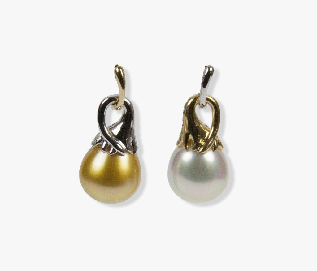 Sensational pair of South Sea Pearl and Diamond 18Karat Gold Earrings
Each earring feature a Beautiful South Sea pearl in diamond encrusted cap and removable huggie; One Golden Pearl and the other White with contrasting white and brown diamonds;