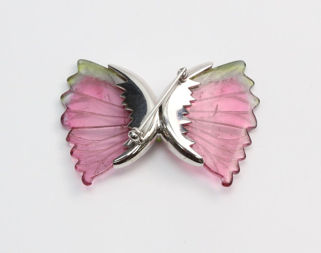 Beautiful Butterfly Brooch with Watermelon Tourmaline Wings, handmade 14K White Gold body pave set with Diamonds, centered by a Genuine oval Green Peridot. Chic and Timeless...Illuminating your look with a touch of Class!