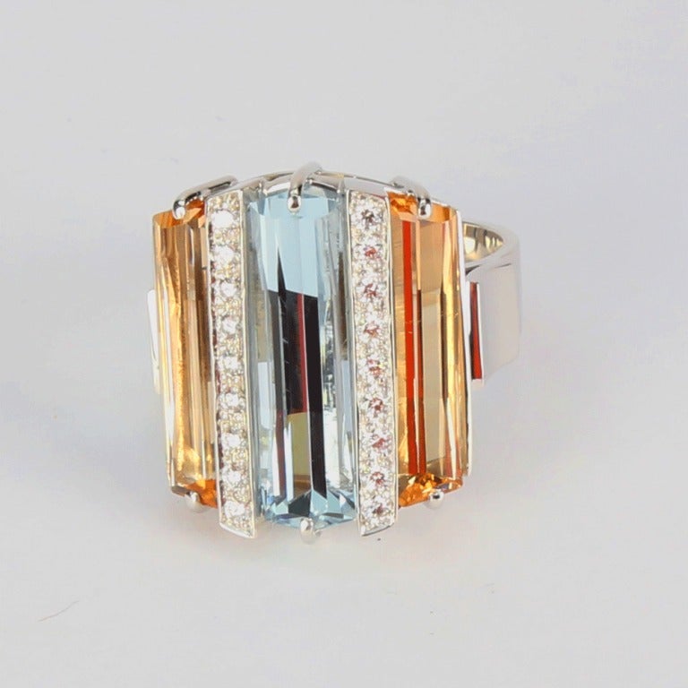 A Captivating Gem set Comet Runway Ring, beautifully arranged and set with step-cut Aquamarine in center, 2 step-cut Topaz and 18 round brilliant cut Diamonds SI2, GH , approx. 0.36ct Ring size 7, we offer ring resizing. More Beautiful in real time!