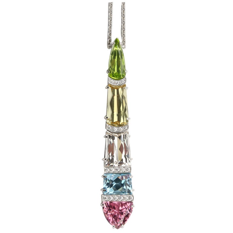 Captivating Genuine Gem set Comet Pendant, beautifully arranged and set with: a Peridot, weighing approx. 3.21ct; a Topaz, weighing approx. 4.65ct; a Rose de France, weighing approx. 6.7ct; a Blue Topaz, weighing approx. 4.88ct and a Pink