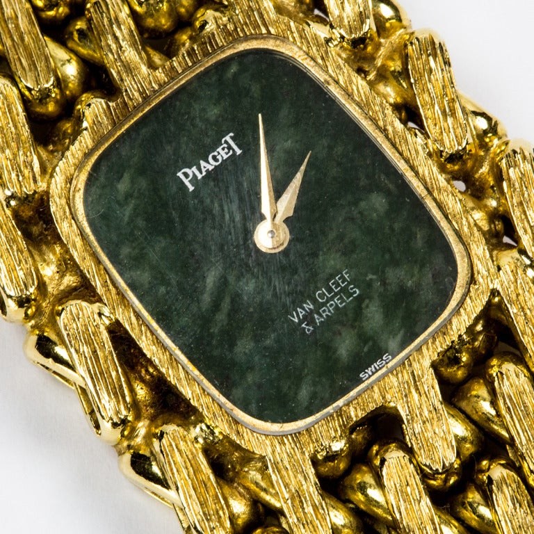 Fabulous Piaget for Van Cleef & Arpels lady's 18k yellow gold bracelet watch with moss green jade dial. The moss green stone dial marked signed Piaget and Van Cleef & Arpels. 

Gross weight approximately 154.3gm=99.2 dwts., manual-wind movement,