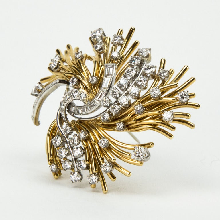 Simply Beautiful! Vintage Mid Century Modern Red Carpet Diamond Gold Brooch. Designed as a Floral Sprig, Hand set with Brilliant-cut Round and Baguette Diamonds; G-H Color; VS-SI1 Clarity and Sparkle Beautifully! Hand crafted 18k yellow Gold