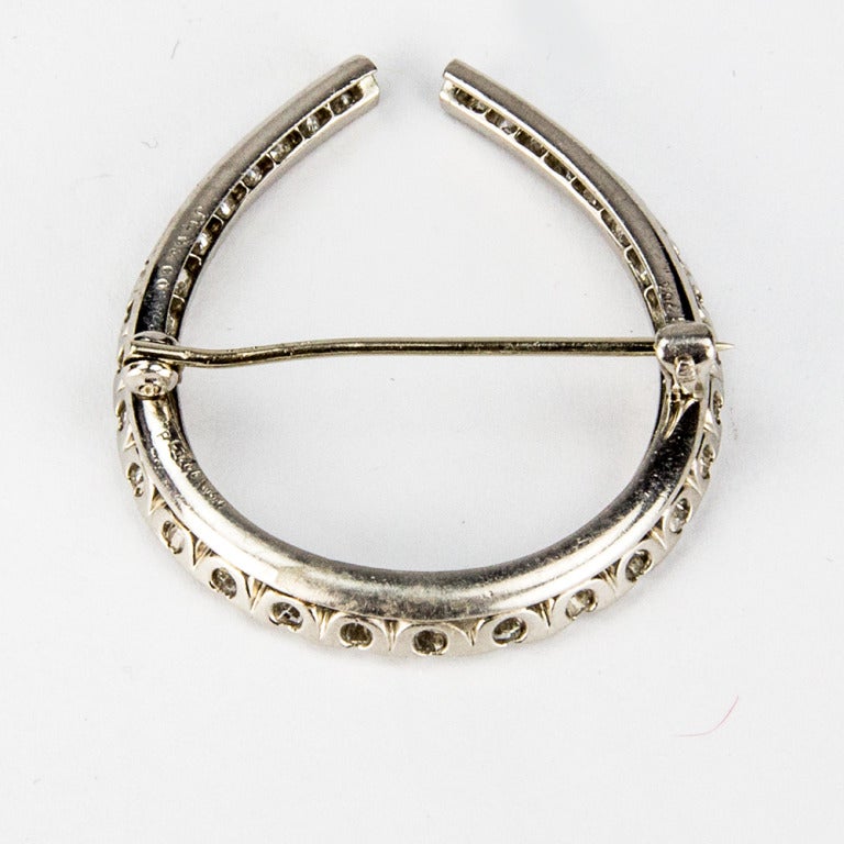 Beautiful Edwardian circa 1910 Diamond handmade Platinum Horseshoe Brooch; set with thirty-one Old European-cut diamonds, weighing approx. 1.35ct. VS2-SI; color H. Signed JEC&CO. A Horseshoe proverbially brings good luck and must be worn right side