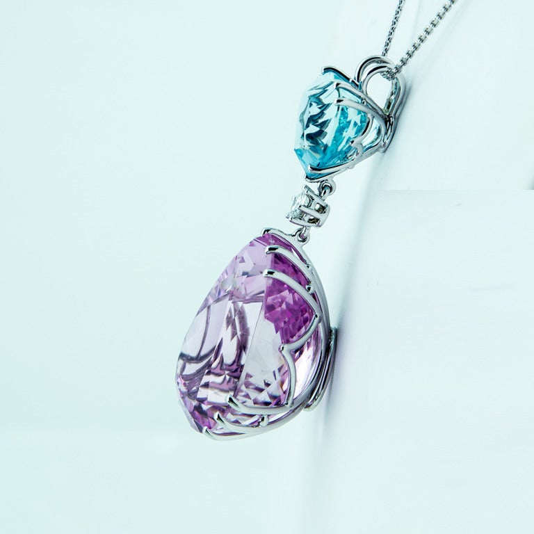 Sensational Pendant Necklace featuring a Pear shaped faceted Pink Kunzite weighing approx.130ct, a Heart shaped faceted Aqua, weighing approx. 29.6ct and a Round Brilliant-cut Diamond, weighing approx .65ct; handmade 14k white gold mounting; pendant