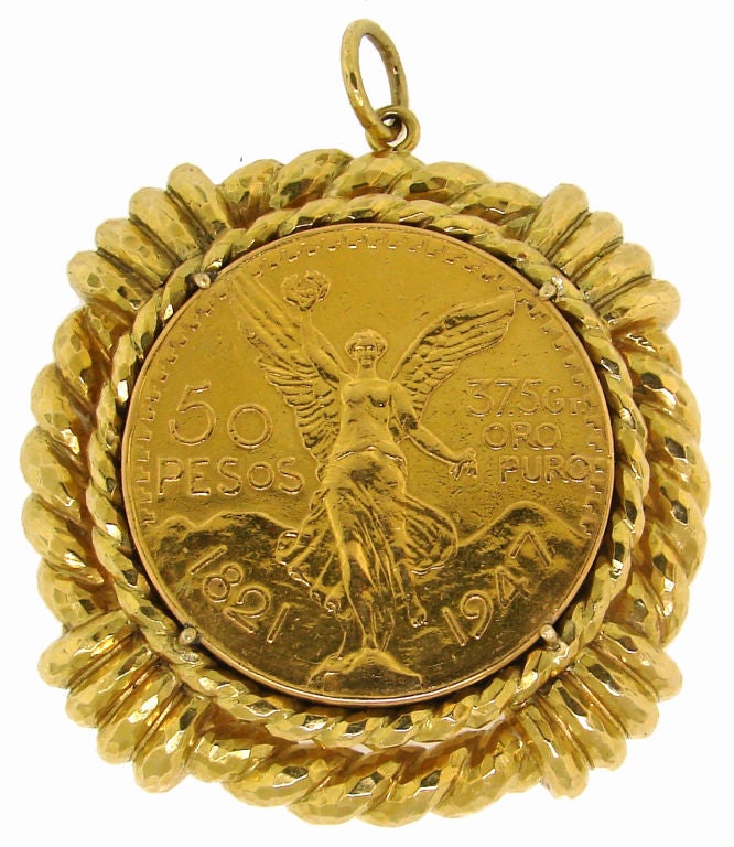 37.5 grams pure gold old Mexican coin framed in 18k yellow gold pendant created by David Webb in the 1970's.
The coin is 1 1/2