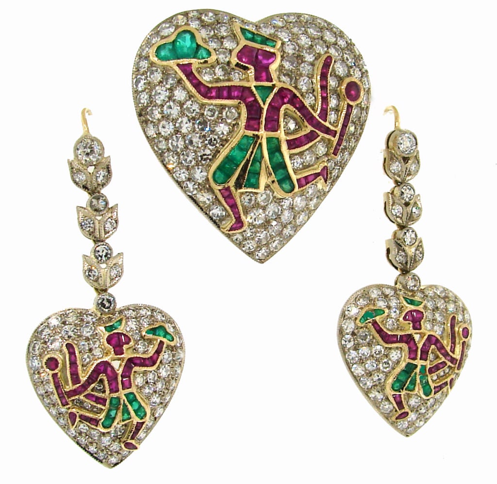 Inspired by Indian epic, lovely set consisting of a pair of earrings and a pin. 
It depicts Hanuman, a Hindu god and an ardent devotee of god Rama. 
When Rama's younger brother Lakshmana was severely wounded during the battle against Ravana, king