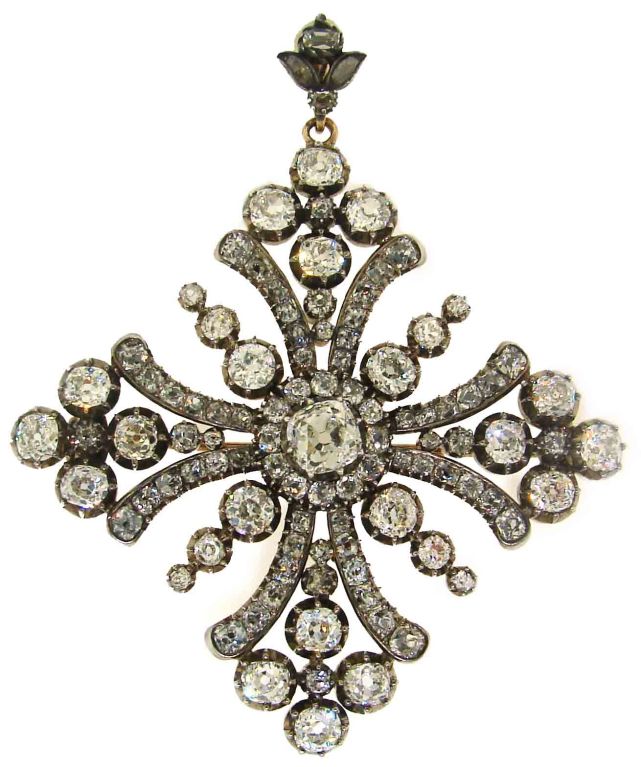 Late Georgian - early Victorian period Maltese cross pin/pendant created in the 1870's. The pin is made of silver and rose gold and set with cushion cut diamonds of total weight approx. 15 cts. The cushion cut diamond in the center measures 6.4 x
