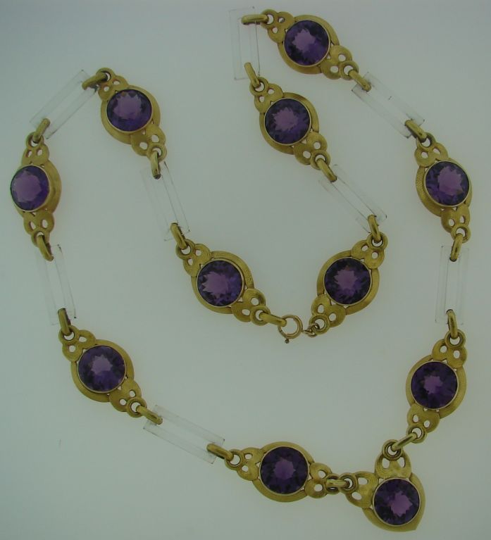 Stunning one-of-a-kind necklace created by Cartier New York in 1931. It is made of 14 karat yellow gold and horn and set with beautiful deep purple amethyst. The gold has a special unique finish because of the little grooves made with hammered by