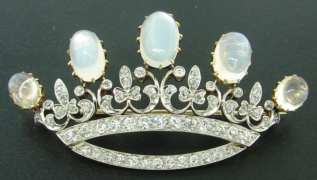 Impeccable style brooch designed as a crown/tiara created by Black Star & Frost in the 1920's. Beautiful lines, perfect proportions,tasteful combination of Old European cut diamonds and oval shape moonstones - highlights of this exquisite finest