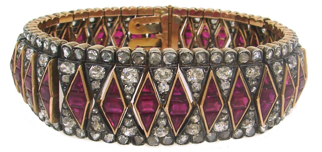 Gorgeous elegant antique bracelet created in Europe in the 1890's. The highlights of this unique piece are the finest quality raspberry color graduating natural rubies specially pre-cut to create the rhombus-shape accents. The bracelet is made of