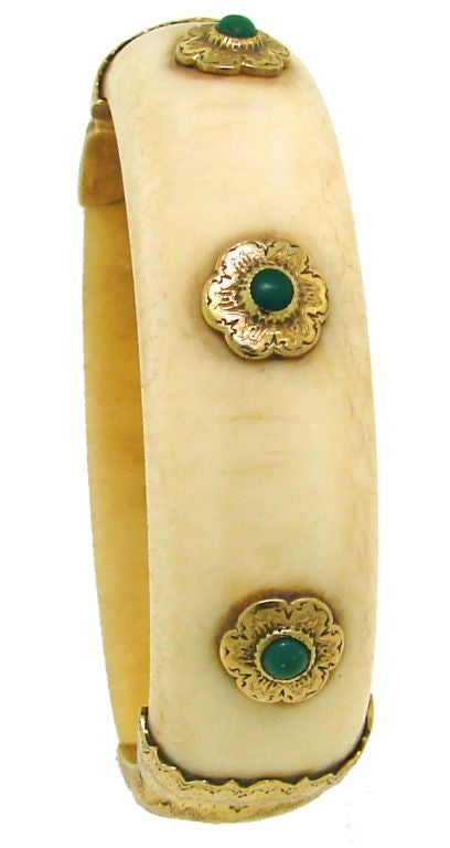 Beautiful bangle created by Buccellati in Italy in the 1950's.<br />
Convex ivory accentuated with turquoise cabochon set in yellow gold with famous finest Buccellati finish.<br />
The bangle is slightly under 3/4