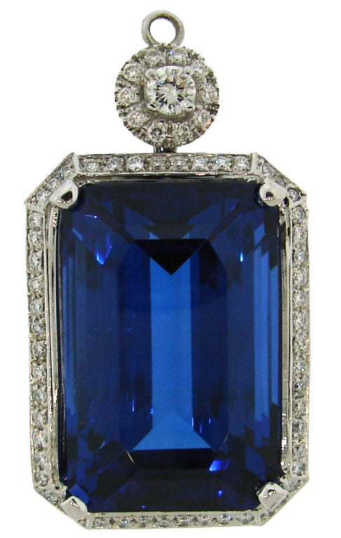 Extra fine gem-quality tanzanite of exceptional size and color of a sapphire tastefully framed in white gold and diamond setting. The tanzanite is accompanied with a GIA Identification Report (see picture 7), stating the color as violetish blue