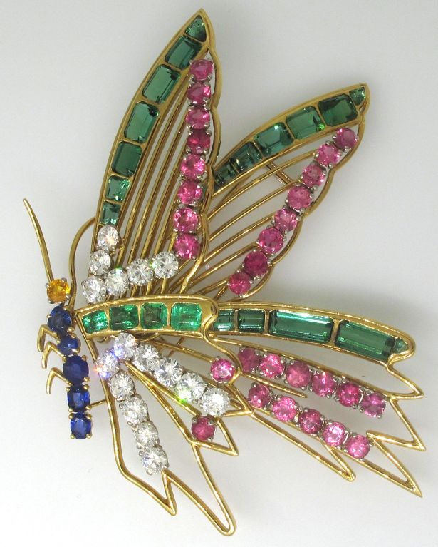 Breathtaking butterfly brooch created by Mellerio in Paris in the 1950's. Shape, size, perfection of the open-work lines, colorful splashes of diamonds, rubies, emeralds, sapphires and tourmalines make this brooch a unique collectible jewel