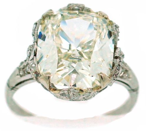 Gorgeous 5.15 ct GIA certified cushion cut diamond is highlight of this stunning Art Deco engagement solitaire ring. The setting is made of platinum and has diamond accents.<br />
The ring is size 6.5 and can be sized if needed.