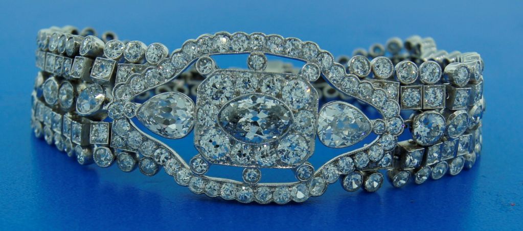 Timeless Art Deco diamond and platinum bracelet created in Europe in the 1930s. Its highlight is an approx. 1.32-ct marquise cut fancy grayish-blue diamond (I1 clarity) framed with cushion and Old European cut diamonds and accentuated with two