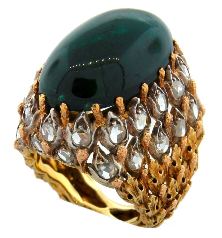 Stunning cocktail ring created by Mario Buccellati in the 1950's in Italy. It features oval cabochon green tourmaline set in yellow gold and accentuated with rose cut diamonds.<br />
The tourmaline measures 23.0 x 15.0 x 18.9 mm.<br />
The ring is