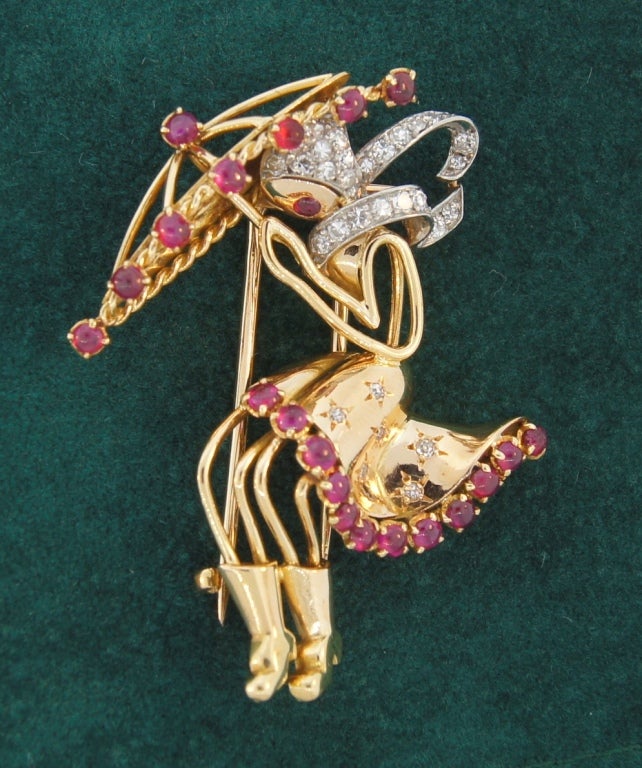 Chic and lovely Retro brooch created in France in the 1940's.
Depicts a pretty girl in nasty weather. She is walking her way holding an umbrella. Her posture, her fluttering dress and scarf, warm hat and high boots tell that she is not only