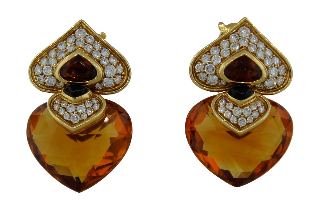 Bold and colorful heart shape earrings created by Marina B in France in the 1980s. Feature heart shape citrine, black onyx and micropave diamonds set in yellow gold.
Upper casual. Chic and wearable!
Marina B maker's marks, French and European
