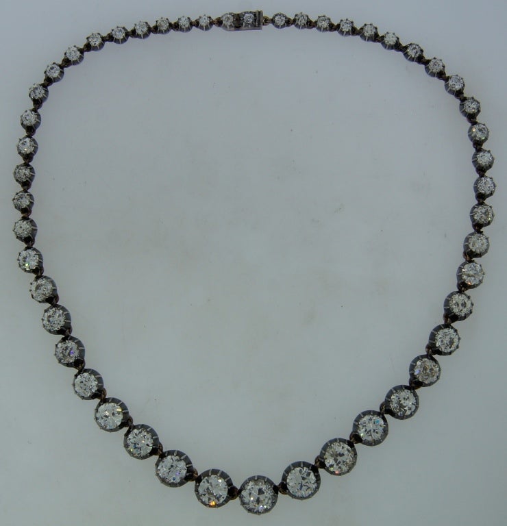 Spectacular antique riviere necklace created at the end of 19th century. It features forty nine Old European cut diamonds graduating from approx. 2.50-ct in the center to 0.10-ct by the clasp. The diamonds are set in silver and rose gold.
Five