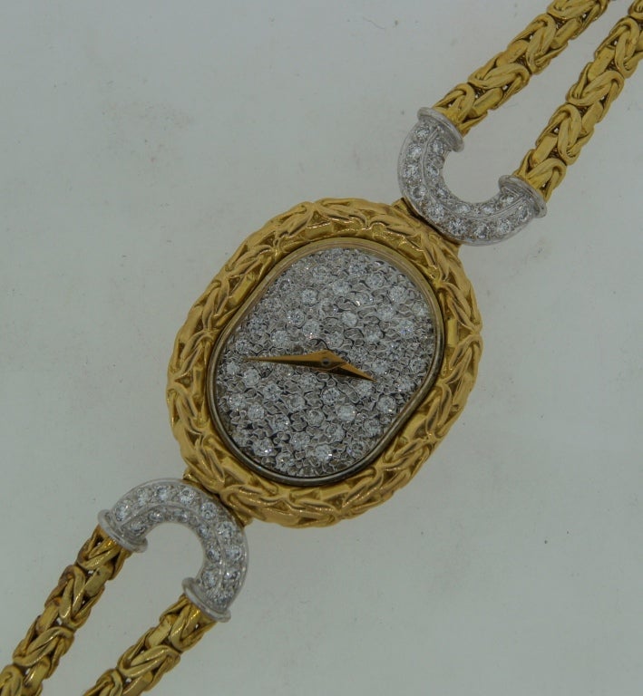 Dressy yet wearable lady's watch created by Bueche-Girod in the 1970s. Made of yellow gold. The dial of the watch is encrusted with diamonds. The bracelet is also made of yellow gold; the parts by the watch case are tastefully accented with diamonds