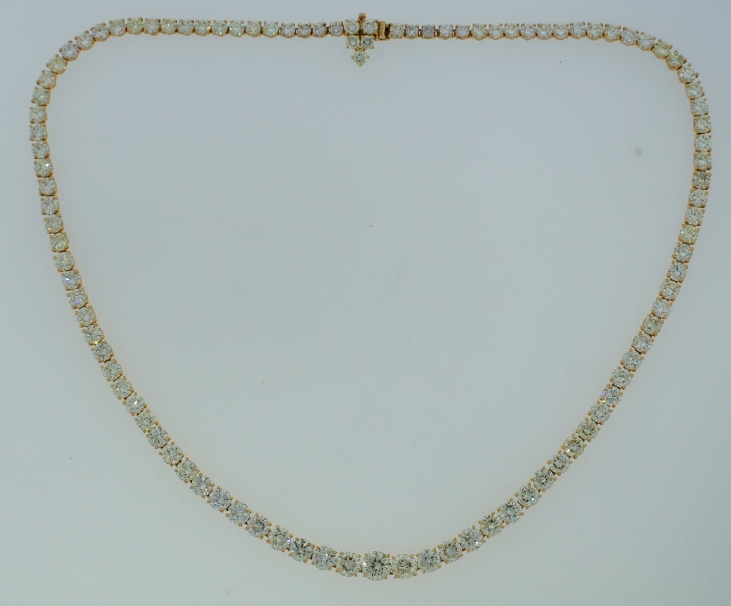 Fabulous diamond Riviere necklace created by exquisite Harry Winston jewelry house. Classy and timeless piece of jewelry that never goes out of style!
Features graduating round brilliant cut diamonds set in 18 karat yellow gold. The diamonds