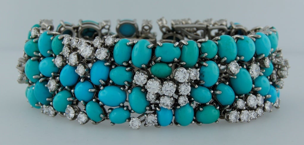 Elegant and stylish bracelet created in France in the 1960's. Features sixty eight oval Persian turquoise and ninety seven diamonds. Turquoise varies in color from blue, to greenish blue. Diamonds are round brilliant cut, G-H color VS clarity, total