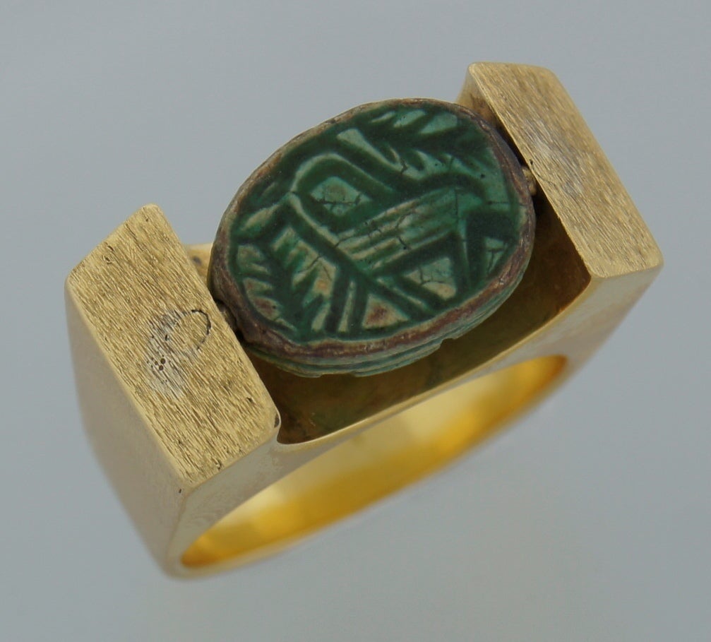 Amazing prominent ring created in the 1930s and inspired by Egyptian Revival motifs. The image of the scarab, conveying ideas of transformation, renewal, and resurrection, was ubiquitous in ancient Egyptian religious and has been used in jewelry