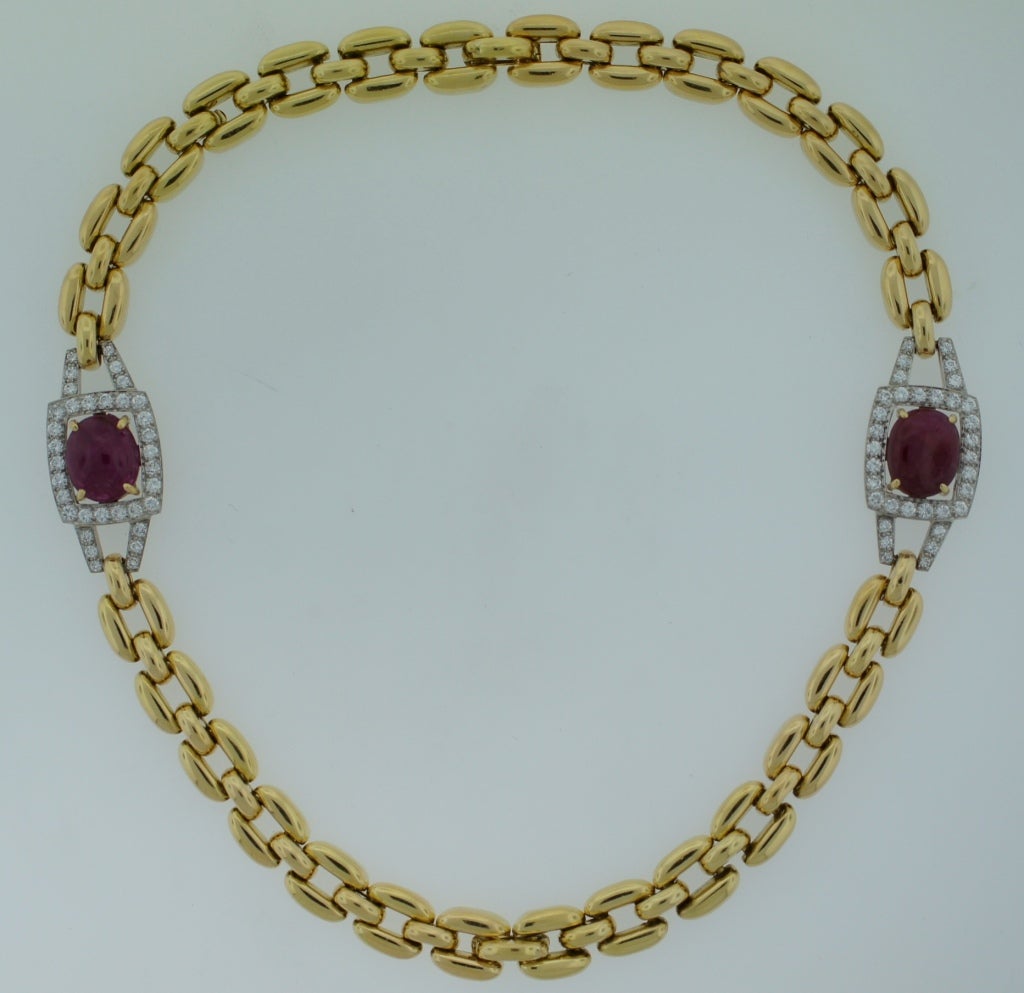 Bold yet elegant necklace created by David Webb in the 1970s. Features two cabochon rubies accented with round diamonds set in yellow gold.
The necklace comes apart and turns into two bracelets. The bracelets are 7.25