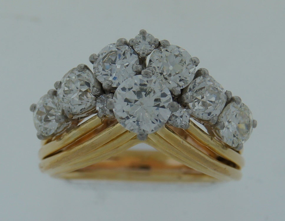 Elegant and feminine ring created by French jewelry house Marchak in Paris in the 1940's. Stylish V shape, finest diamonds are the highlights of this piece. 18k yellow gold setting. 
10 Old European cut diamonds - total weight approx. 2.72