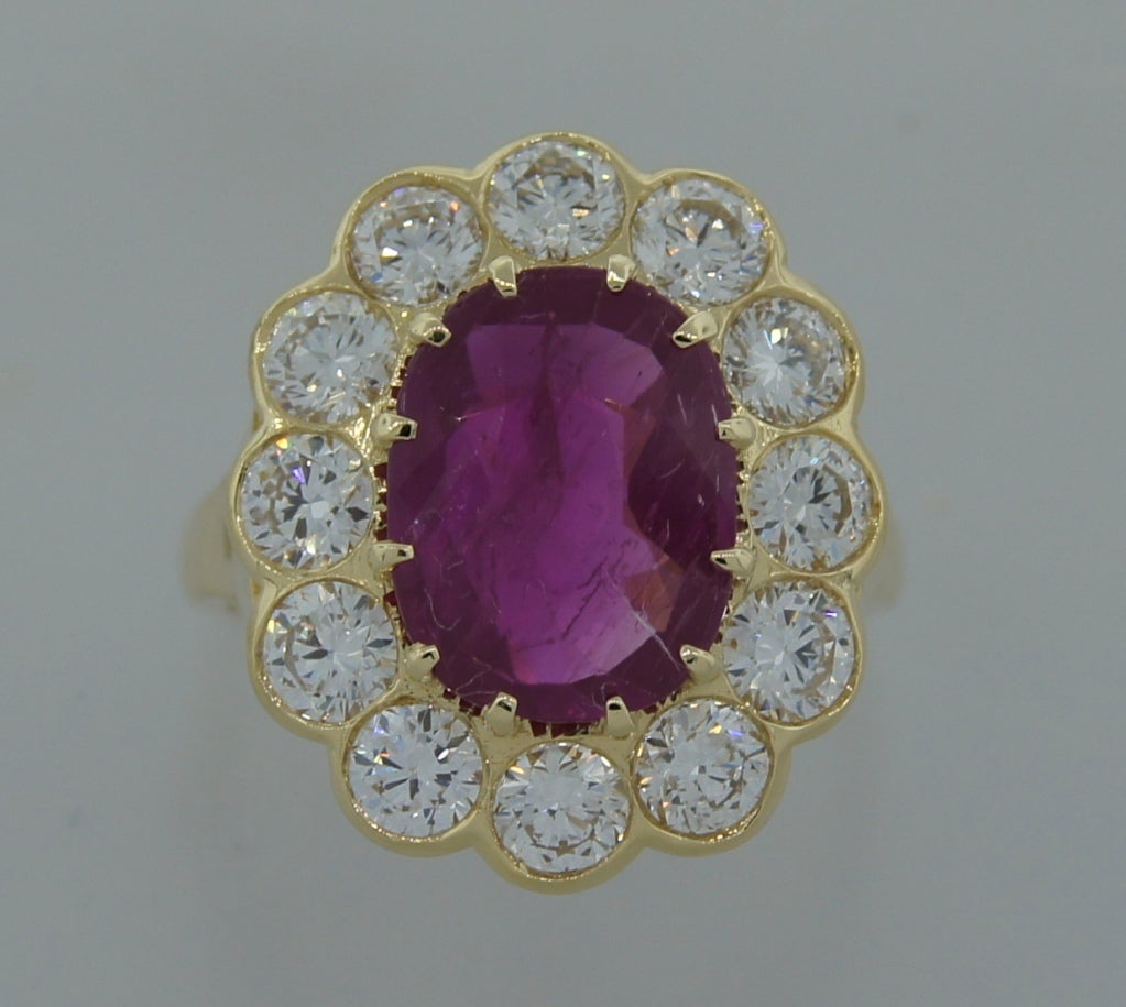 Stunning cocktail ring created in the 1970's. Features a 3.96-ct NON-HEATED cushion cut BURMESE RUBY. The ruby comes with a Gubelin Lab certificate dated January 2010. Gorgeous stone! The ring is made of yellow gold and the ruby is surrounded with