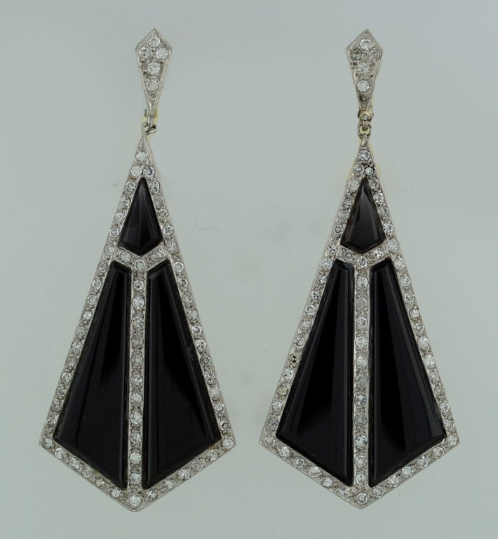 Amazing dangling earrings with strong geometrical design that was typical for Art Deco era. Created in Europe in the 1920's. Made of platinum (tested), feature black onyx and studded with single cut diamonds.
Stylish, elegant, wearable!
The