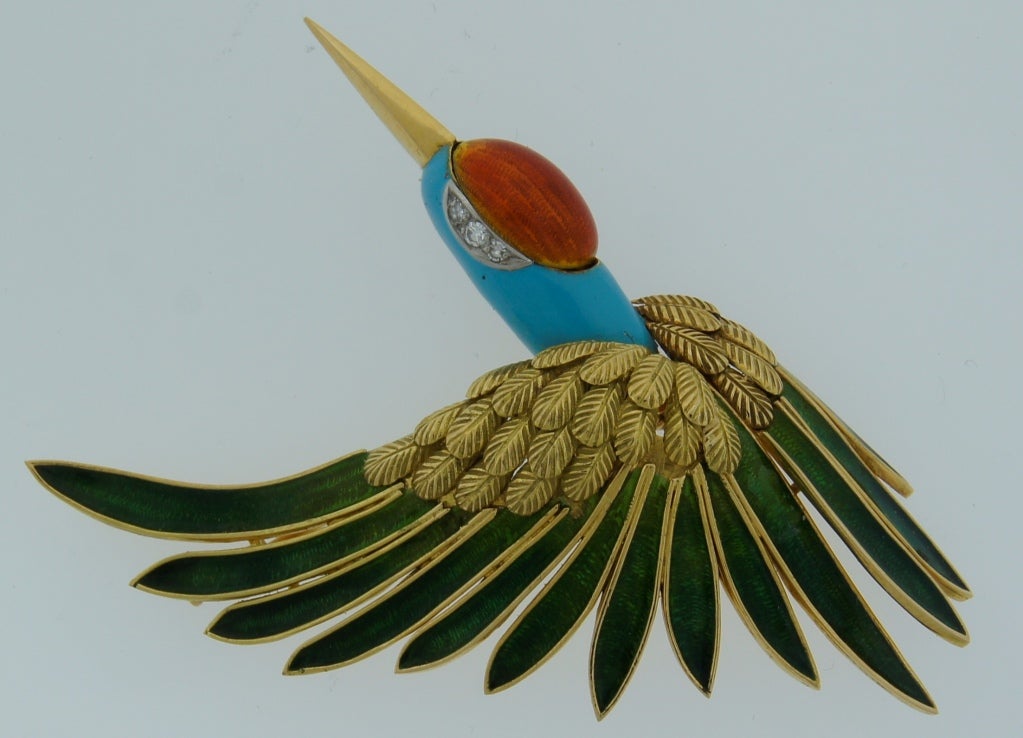 Exquisite brooch created by Mauboussin, Paris in the 1950's. Chic and wearable! It is designed as a stork bird.
Made of 18k yellow gold, decorated with beautiful enamel and accented with diamonds. 
It is 2-3/4