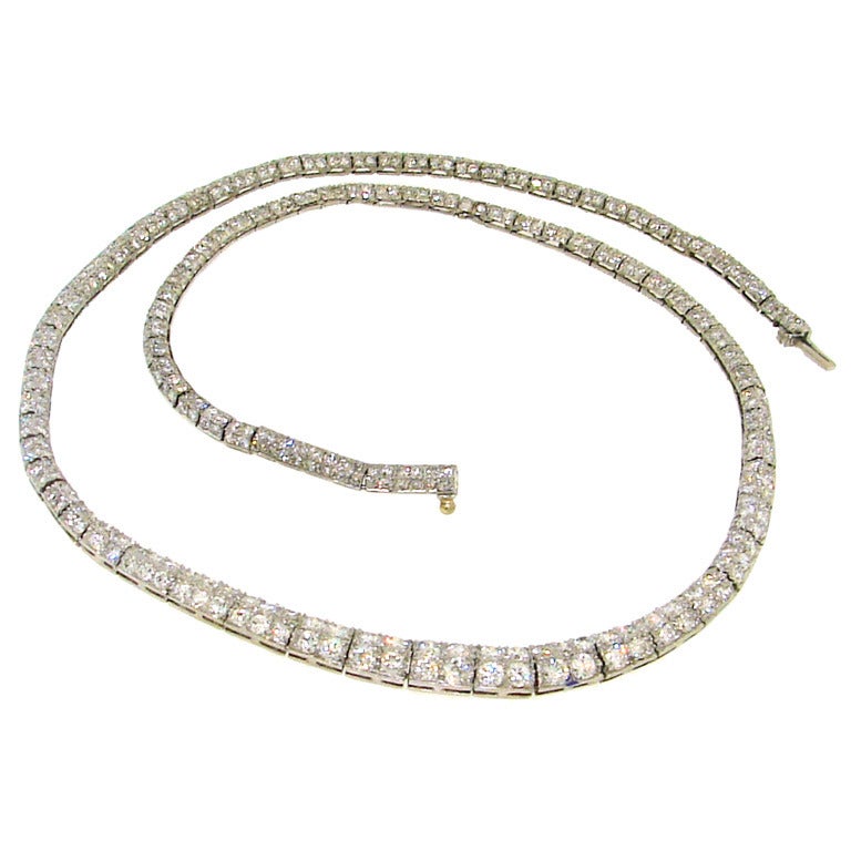 Elegant classy Art Deco necklace created by Tiffany & Co. in the 1920's. It is made of platinum and set with single cut diamonds (total weight approx. 5.80 carats).
It looks way better on the neck!
The width of the necklace is graduating from 1/4