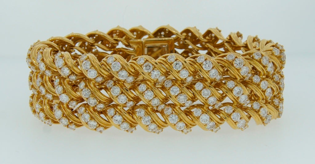 Nice and heavy bracelet created by Tiffany & Co. in the 1980's. Made of yellow gold and set with 144 round brilliant cut diamonds - total weight approximately 17.28 carats (G, VS). Volume, flexibility, outstanding workmanship! Fits up to 7