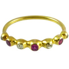 An Antique Gold, Diamond and Ruby Bangle