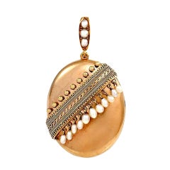 An Antique Gold Locket with Pearl Accents